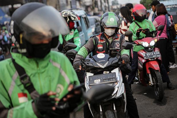 Gojek dan Grab: Merger Mengundang Sorotan Driver